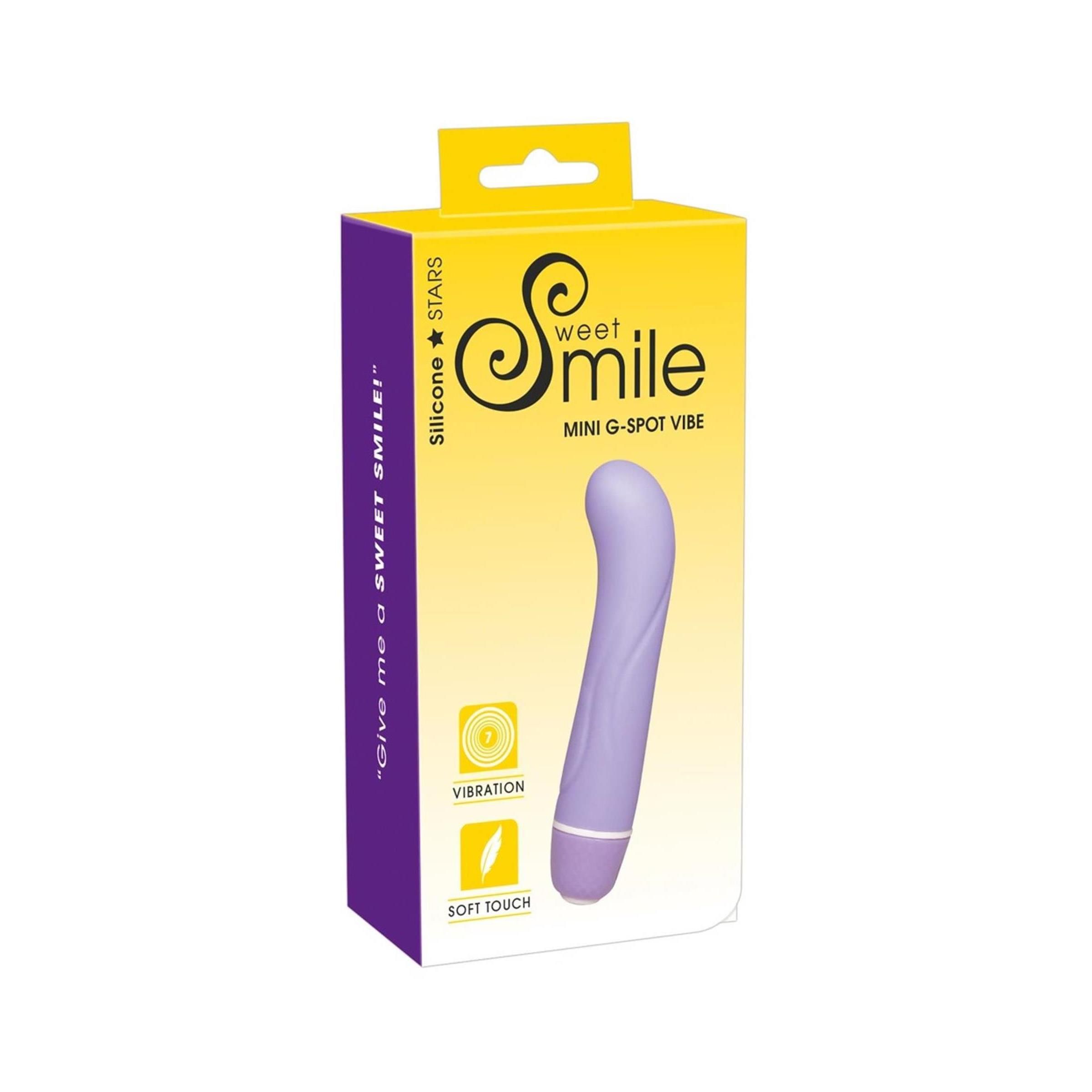 Lila Mini-G-Punkt-Vibrator in Verpackung. Aufschrift: Sweet Smile, Mini G-Spot Vibe. Mit Vibration und Soft Touch Symbolen.