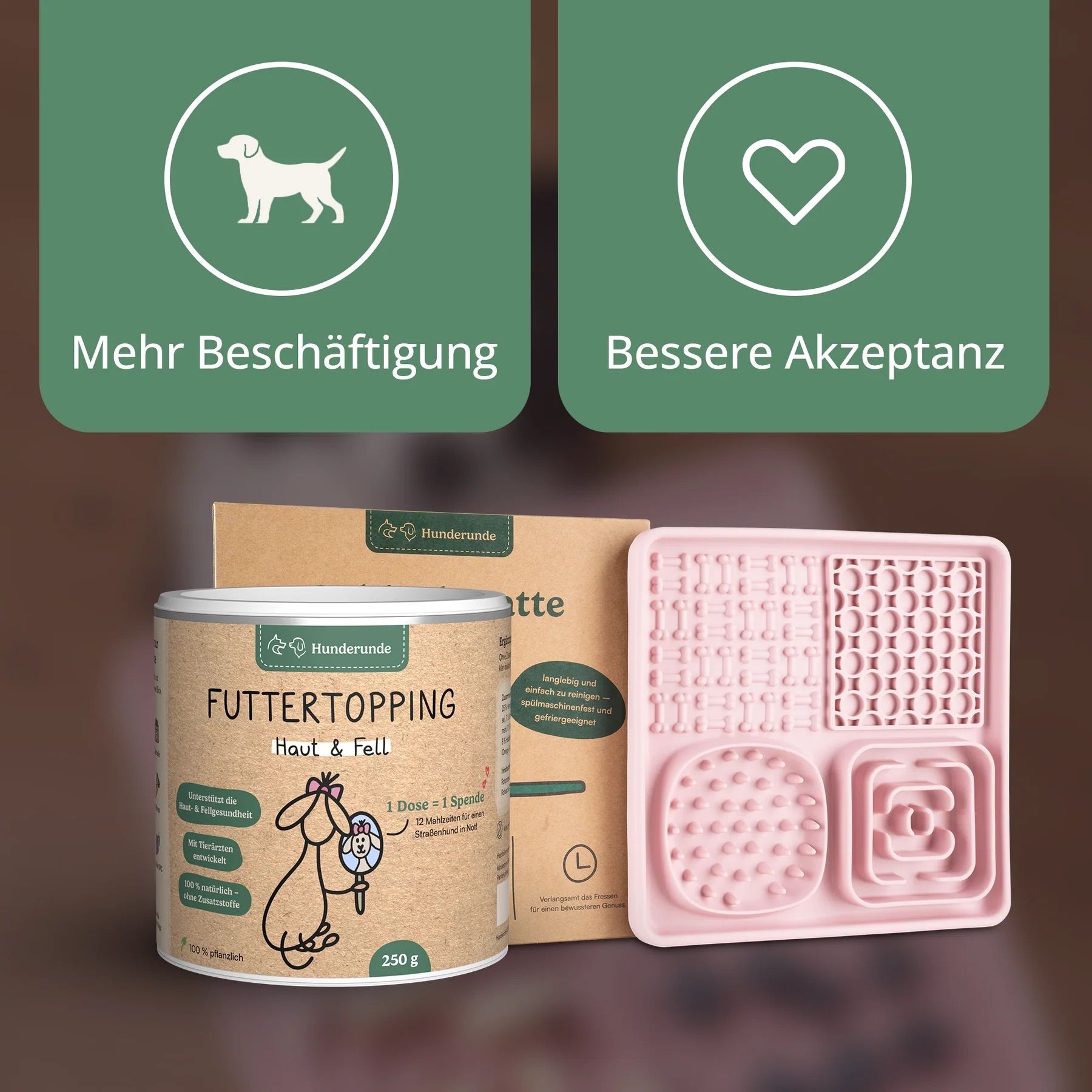 Futtertopping-Dose, Futtermatte und Verpackung. Dose mit Aufschrift 'Hunderunde Futtertopping Haut & Fell'. Rosa Futtermatte.