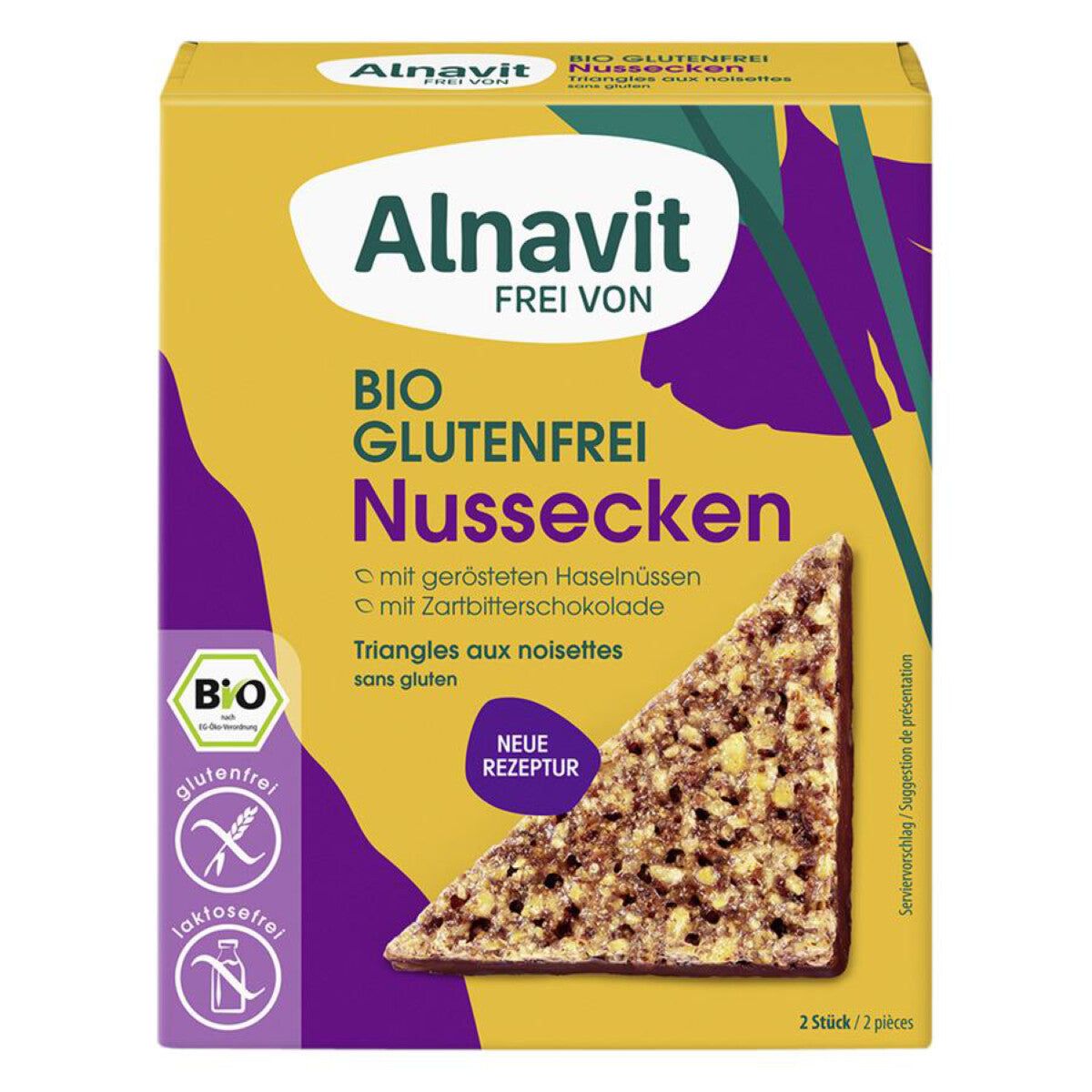 Verpackung mit "Alnavit"-Logo. Aufschrift "BIO GLUTENFREI Nussecken". Enthält glutenfreie Dreiecke mit Haselnüssen und Zartbitterschokolade. Bio-Siegel.