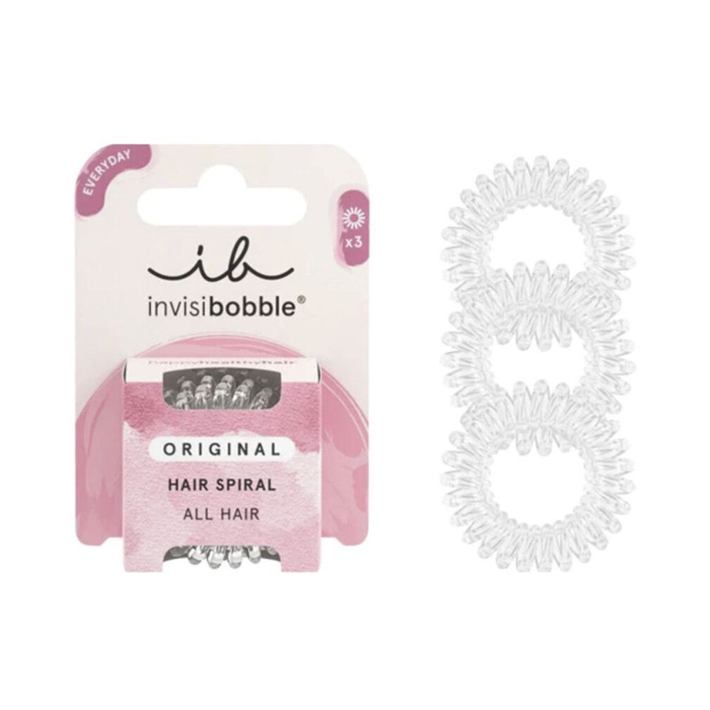 Drei transparente Haargummis neben einer Verpackung mit drei Haargummis. Verpackung mit Schriftzug 'ib invisibobble'.