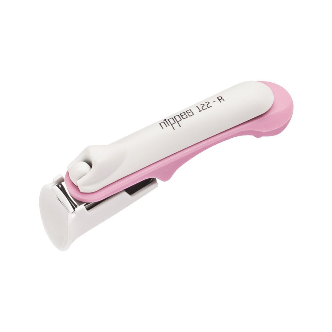 Baby Nagelknipser, weiß-rosa. Griff und Hebel rosa, Schneidebereich silberfarben. Aufschrift: nippes 122-R.