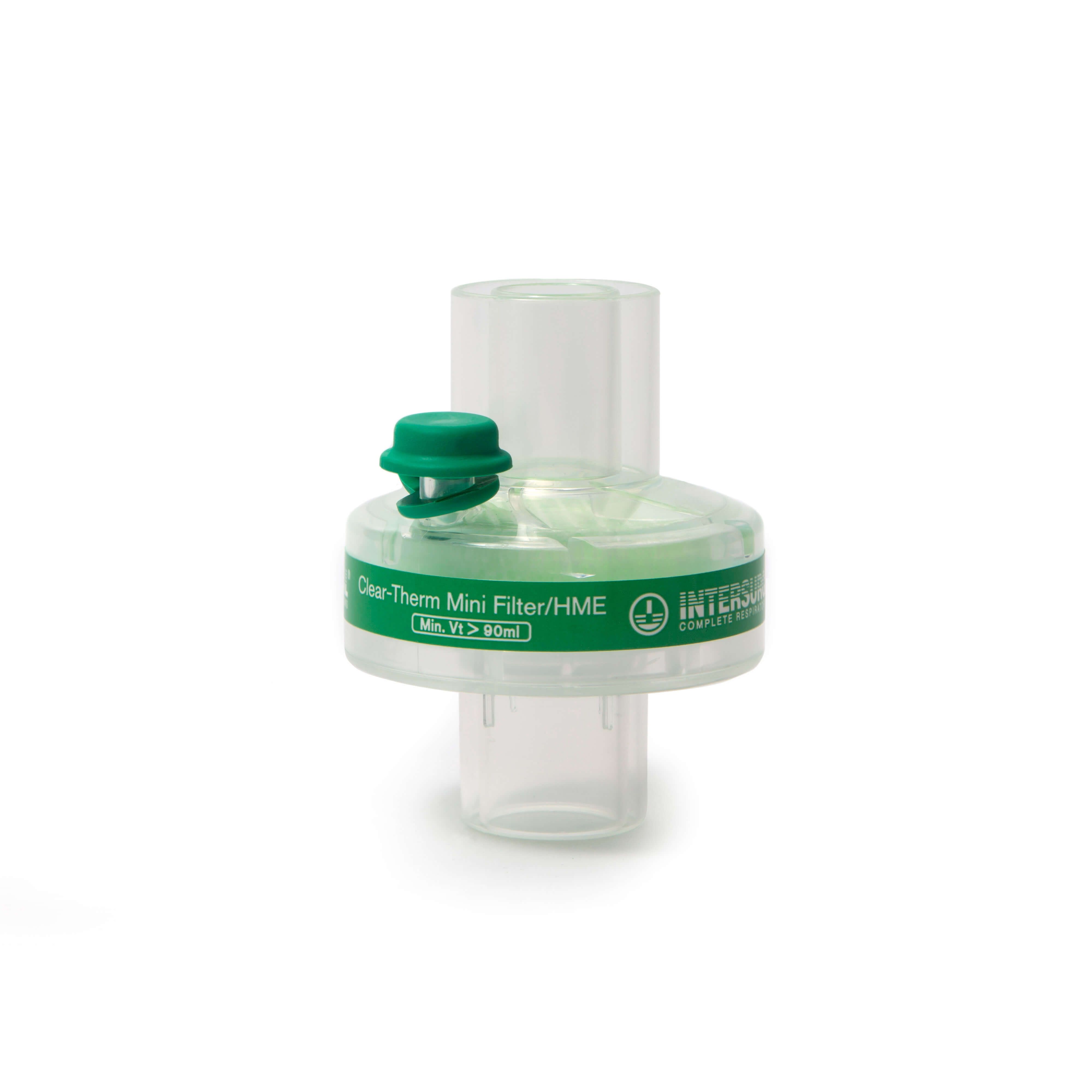 Transparenter Beatmungsfilter mit grünem Deckel. Aufschrift: Clear-Therm Mini Filter/HME, Intersurgical.