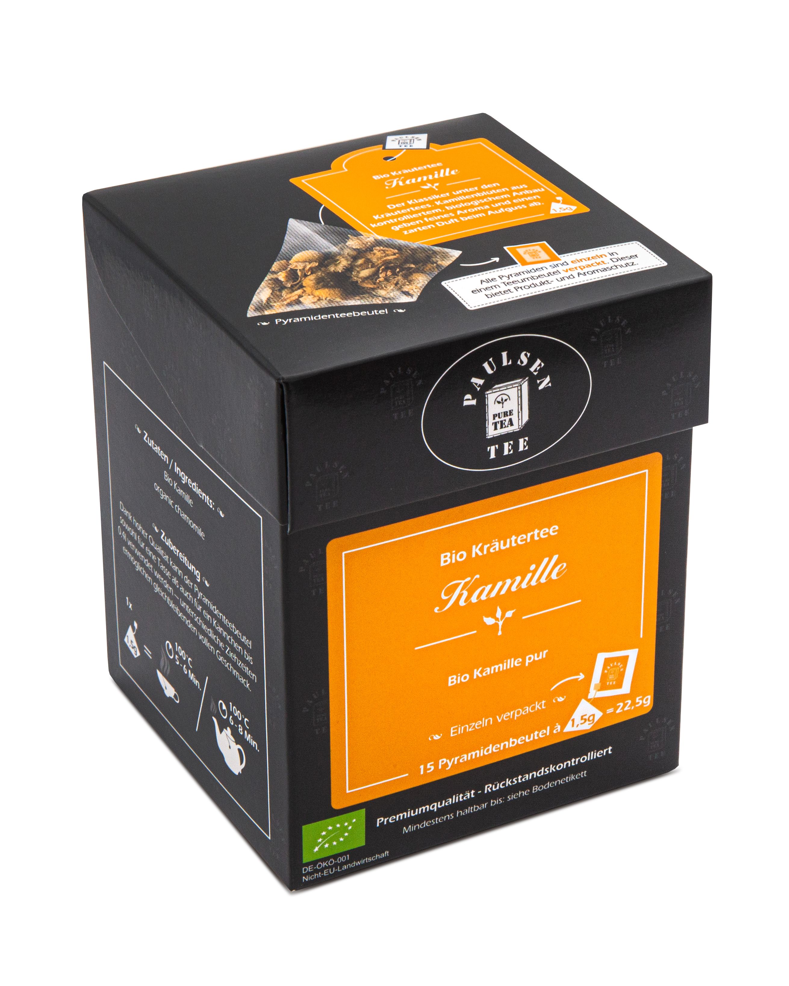 Schwarze Verpackung mit gelbem Etikett. Aufschrift: Paulsen Tee, Bio Kamillentee. 15 Pyramidenbeutel.
