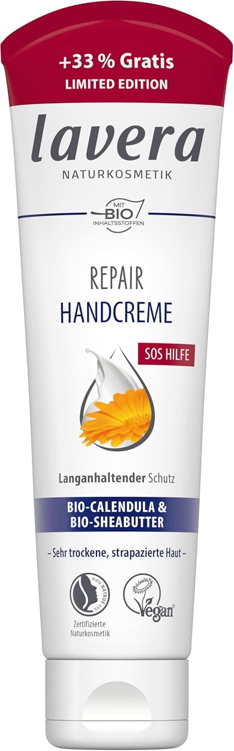 Weiße Tube mit rotem Deckel. Aufschrift: lavera Repair Handcreme. Enthält Bio-Calendula & Bio-Sheabutter. Vegan.