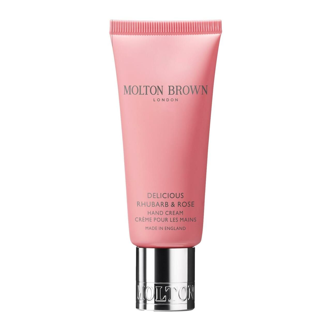 Rosa Handcreme-Tube mit silberner Kappe. Aufschrift: Molton Brown London, Delicious Rhubarb & Rose Hand Creme. Hergestellt in England.