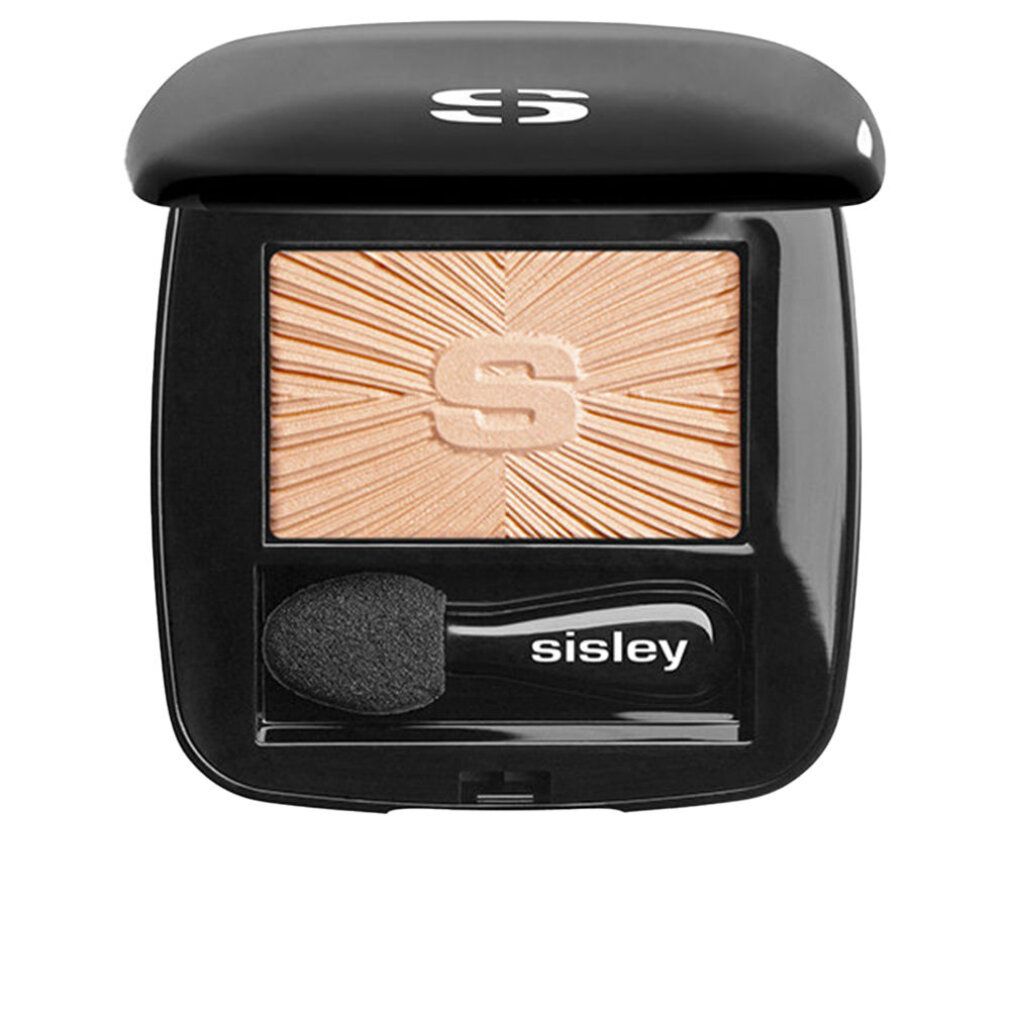 Offener schwarzer Kosmetikkasten mit Lidschatten und Pinsel. Sisley-Logo sichtbar.