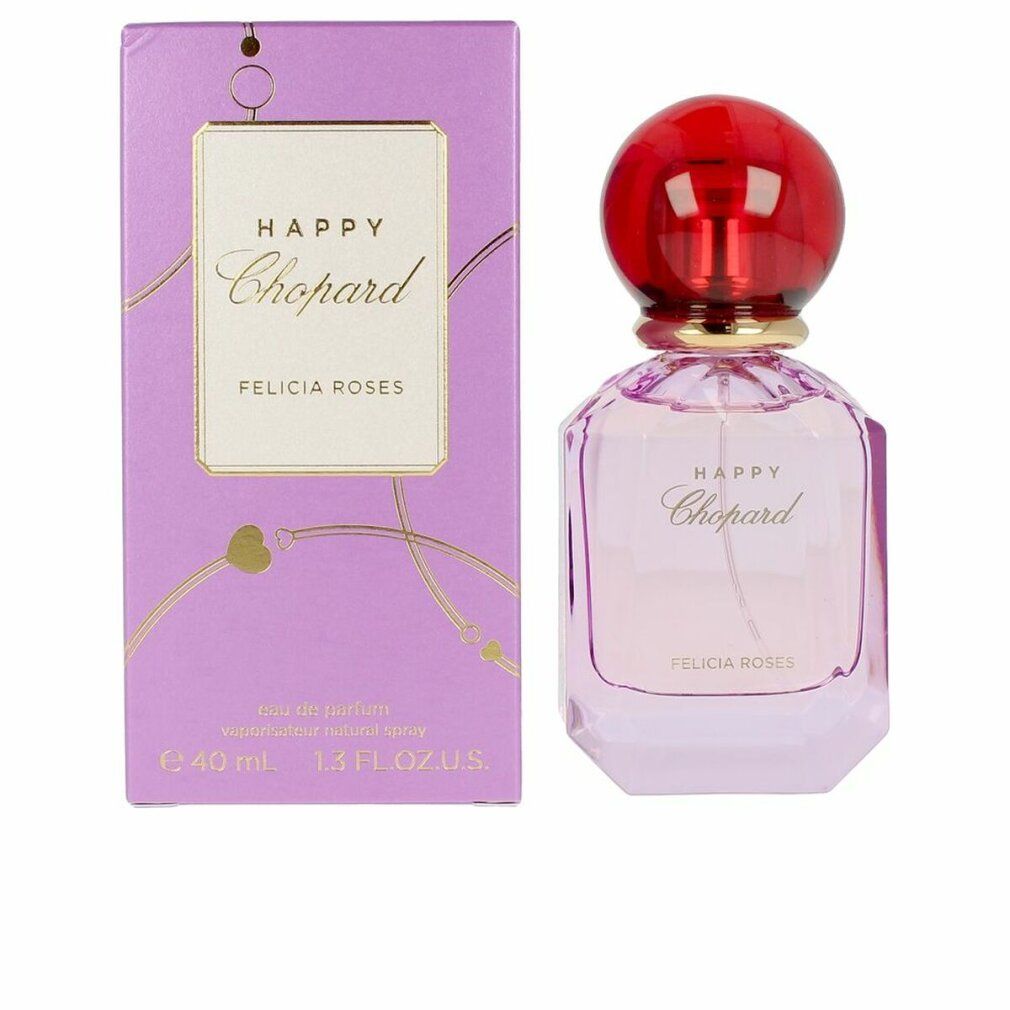 Parfümflakon und Verpackung. Flakon rosa, roter Deckel. Verpackung lila mit goldener Schrift. Aufschrift: Happy Chopard Felicia Roses.