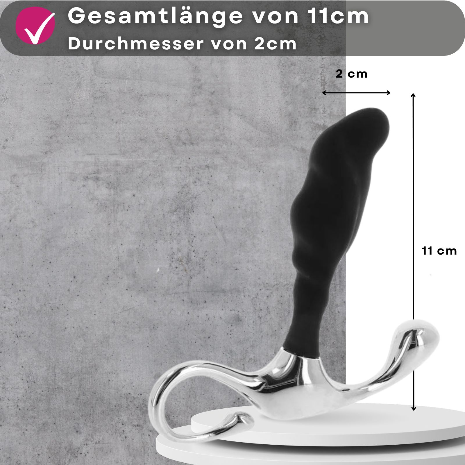 Schwarzer, ergonomisch geformter Artikel mit silbernem Griff. Gesamtlänge 11cm, Durchmesser 2cm.