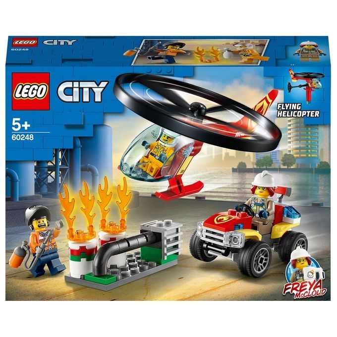 Set LEGO City Elicottero dei Pompieri. La confezione mostra un elicottero, un veicolo dei pompieri e delle figure. L'elicottero ha un rotore nero e una coda rossa. Il set include anche una figura con un estintore ed elementi di fiamma.