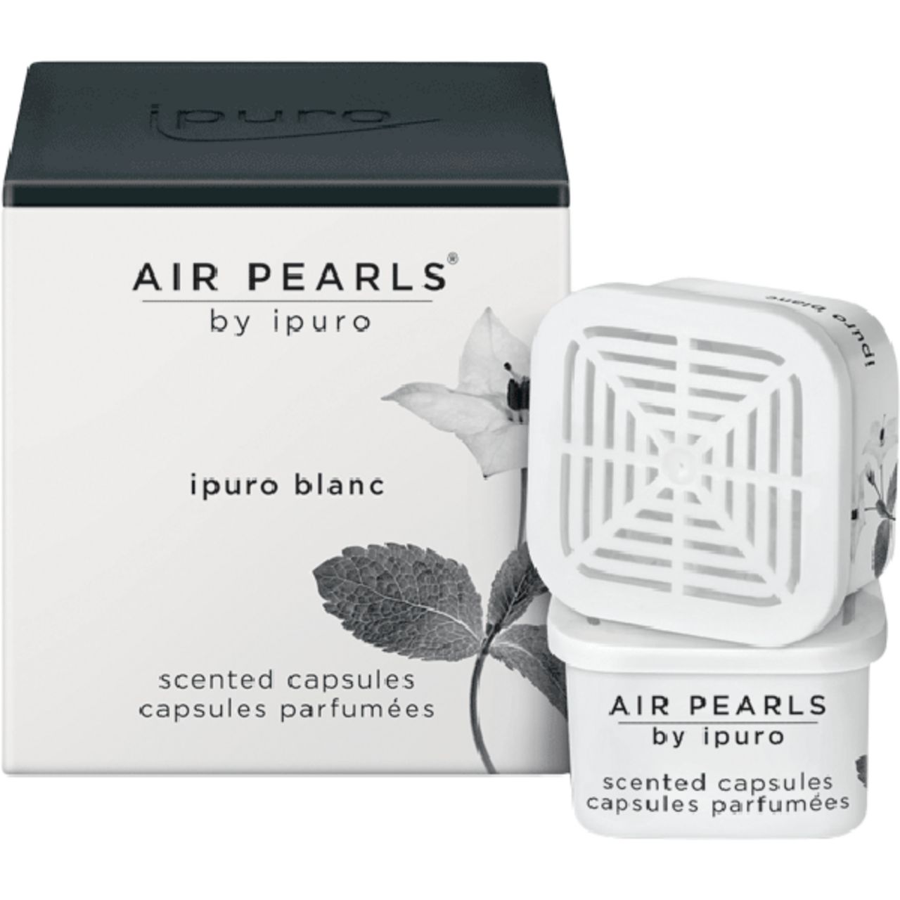Weiße "Air Pearls" Kapseln von Ipuro. Quadratische Form, mit Deckel und floralem Design. Verpackung mit Schriftzug "Air Pearls by ipuro blanc".