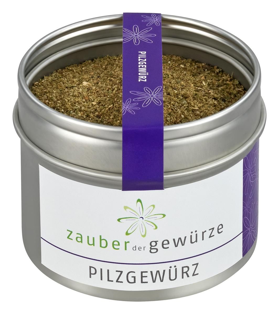 Runde Dose mit Pilzgewürz. Aufkleber mit Schriftzug 'Zauber der Gewürze' und 'Pilzgewürz'. Lila Band mit Schriftzug.