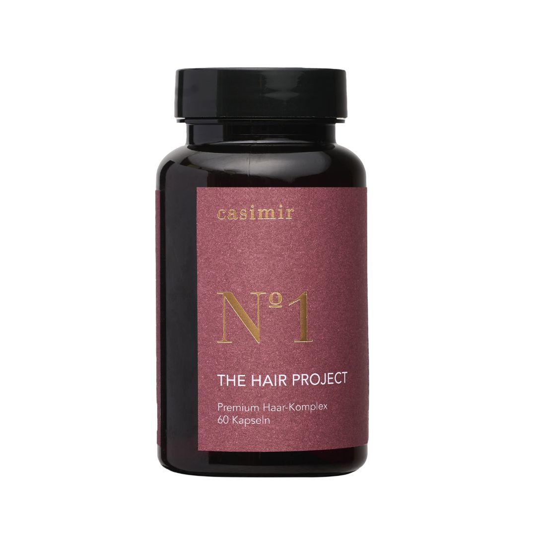 Braune Flasche mit schwarzem Deckel. Aufschrift: casimir, N°1, THE HAIR PROJECT, Premium Haar-Komplex, 60 Kapseln.