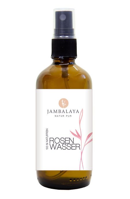 Braune Glasflasche mit Sprühkopf. Aufkleber mit "Jambalaya Natur Pur" und "Rosenwasser". Rosa Pflanzenillustration.