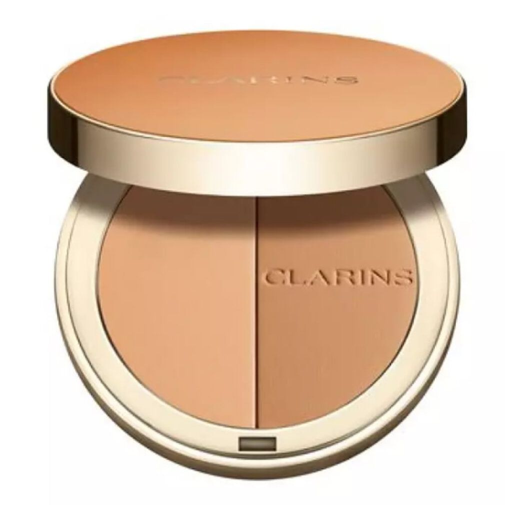 Runder Bronzer-Kompaktpuder mit zwei Farbtönen. Deckel und Puder in Goldtönen. Marke: Clarins.
