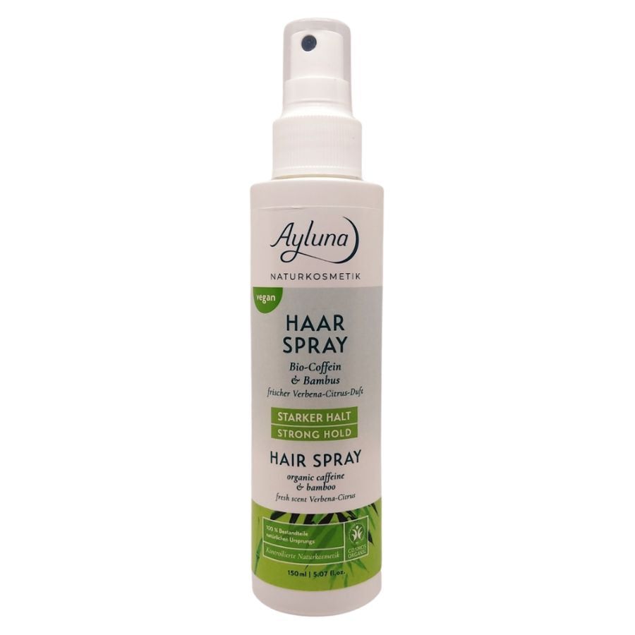 Ayluna Haarspray. Weiße Flasche mit Sprühkopf. Text: Haar Spray, Bio-Coffein & Bambus, Starker Halt, vegan. Grün-weiße Verpackung.