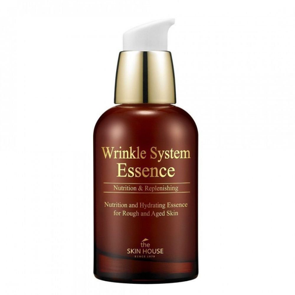 Braune Flasche mit weißem Pumpkopf. Aufschrift: Wrinkle System Essence, Nutrition & Replenishing. Marke: the SKIN HOUSE.