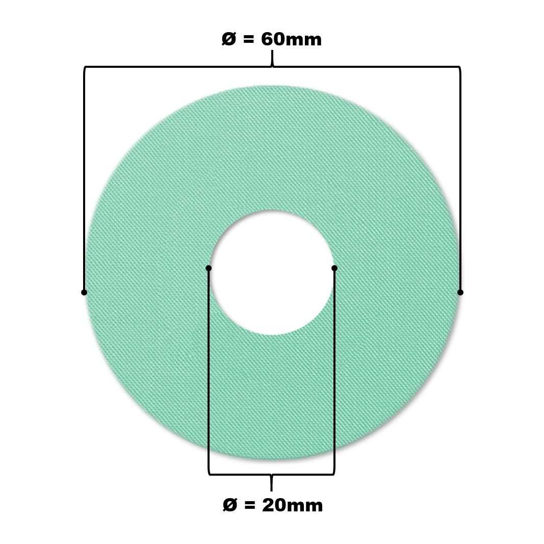 Runder, mintfarbener Katheterpatch mit zentralem Loch. Durchmesser 60mm, Loch 20mm.