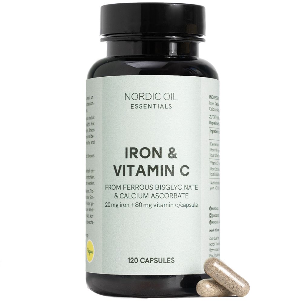 Braune Kapseln neben einer schwarzen Flasche mit dem Etikett "Iron & Vitamin C". 120 Kapseln.