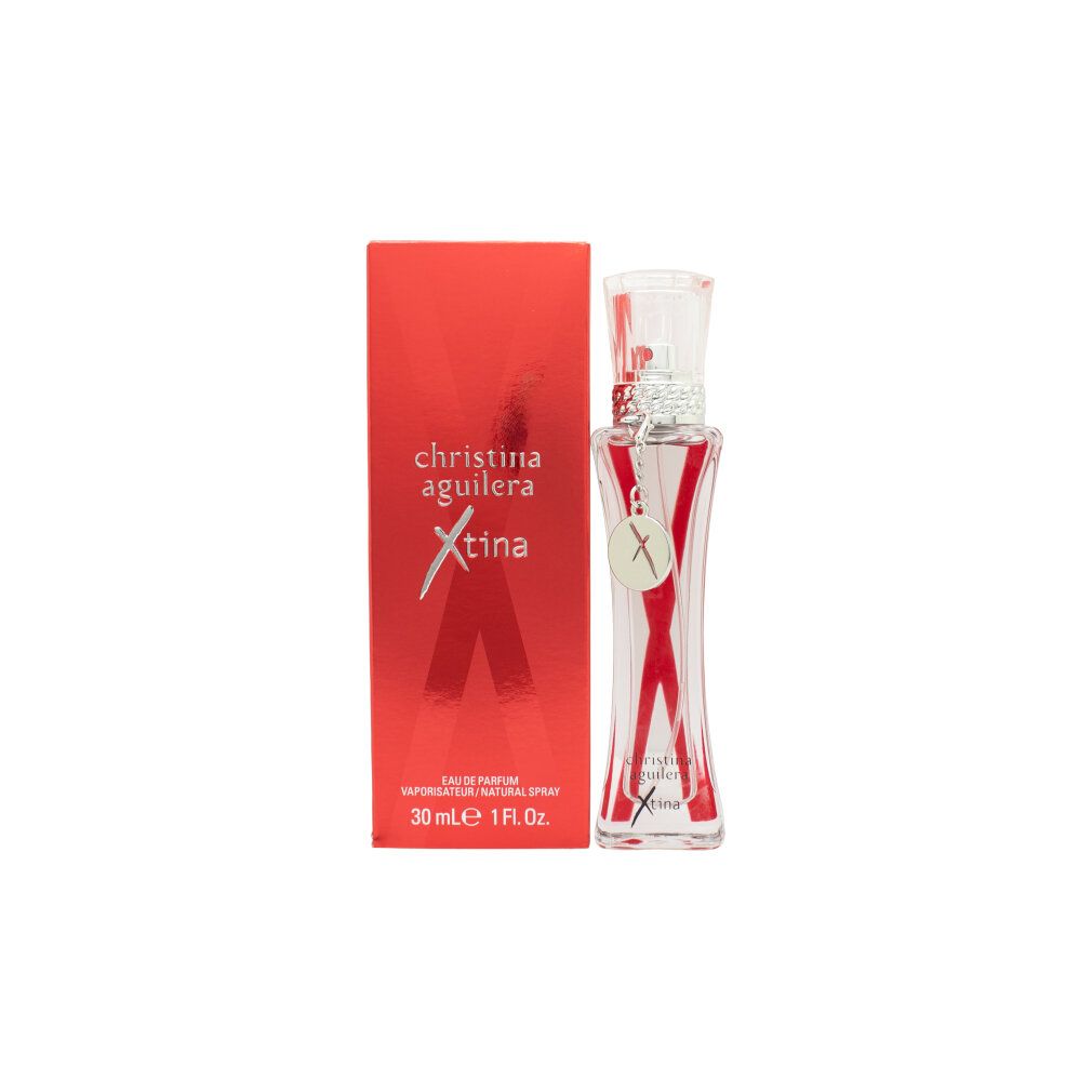 Christina Aguilera Xtina Eau de Parfum Flakon und rote Verpackung mit silbernem Anhänger, Nahaufnahme.