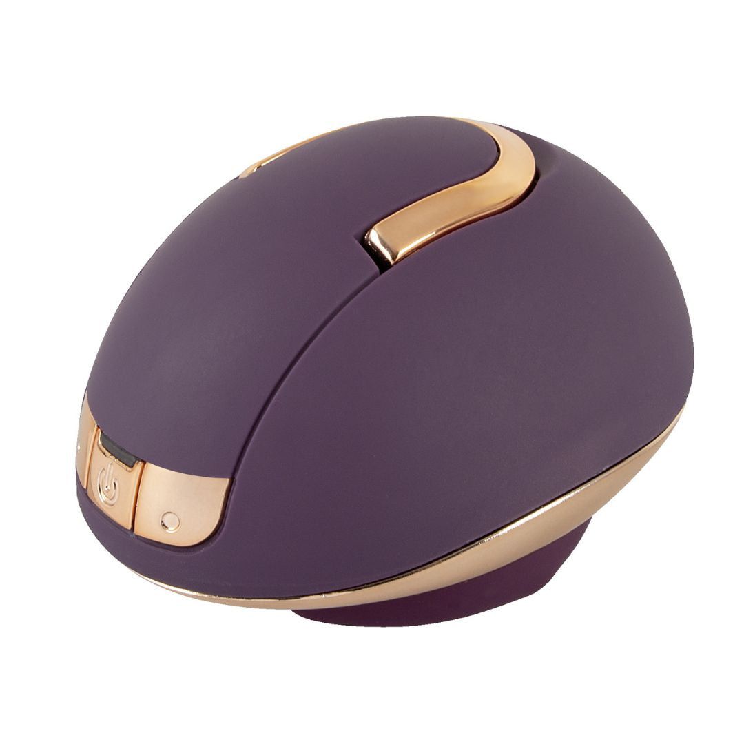 Lila-farbener Auflegevibrator mit goldfarbenen Akzenten. Runde Form mit Bedienfeld.