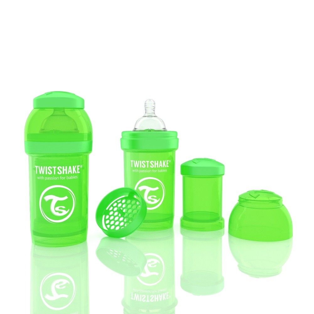 Grüne Babyflasche mit Zubehör. Sichtbar: Flasche, Deckel, Sieb, Behälter. Aufschrift: Twistshake.