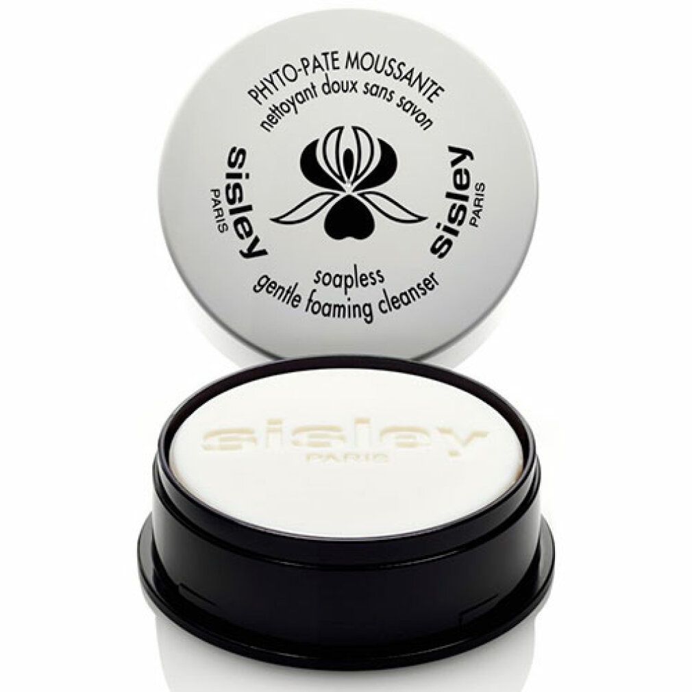 Weißer Behälter mit schwarzem Boden. Deckel mit Schriftzug: Phyto-Pate Moussante, Sisley. Darunter ein weißes Produkt mit Sisley-Schriftzug.