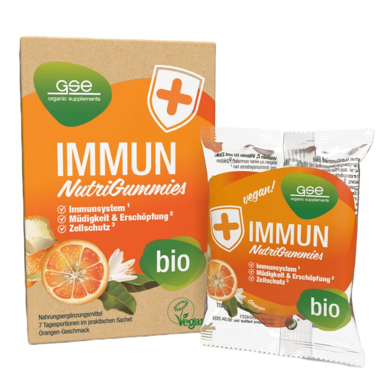 Verpackung mit GSE Immun NutriGummies. Orangefarbenes Design mit Produktnamen und Logos. Einzelpackung daneben.