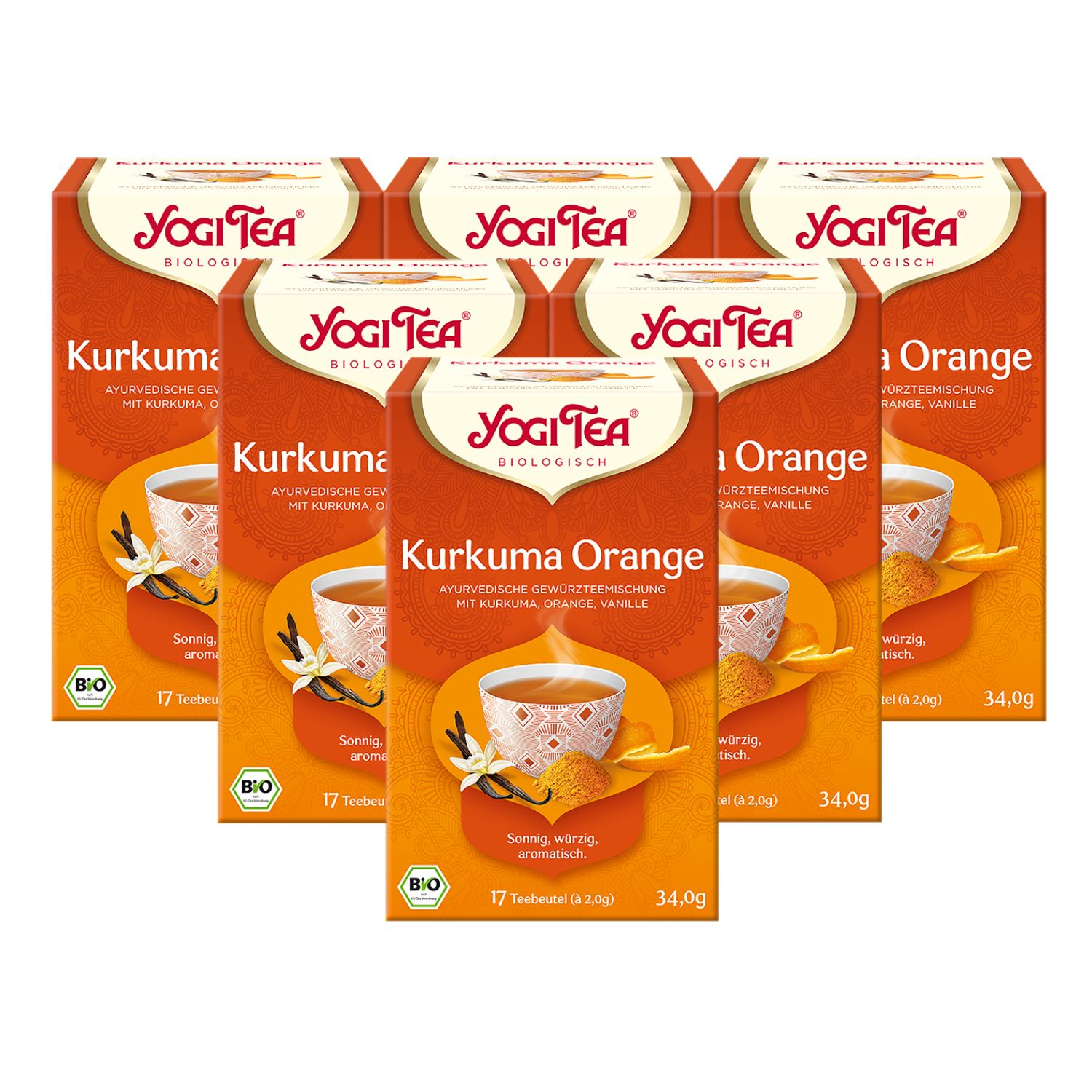 Sechs Packungen Yogi Tea Kurkuma Orange Bio Gewürztee. Jede Packung zeigt eine Tasse Tee mit Kurkuma und Vanille. Bio-Siegel.