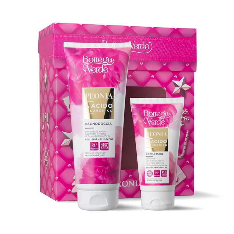 Cofanetto regalo Bottega Verde Peonia, contenente un tubo grande di bagnodoccia e un tubo più piccolo di crema mani, entrambi con motivi floreali rosa. La confezione è una scatola regalo rosa con stelle e un motivo a fiocco.