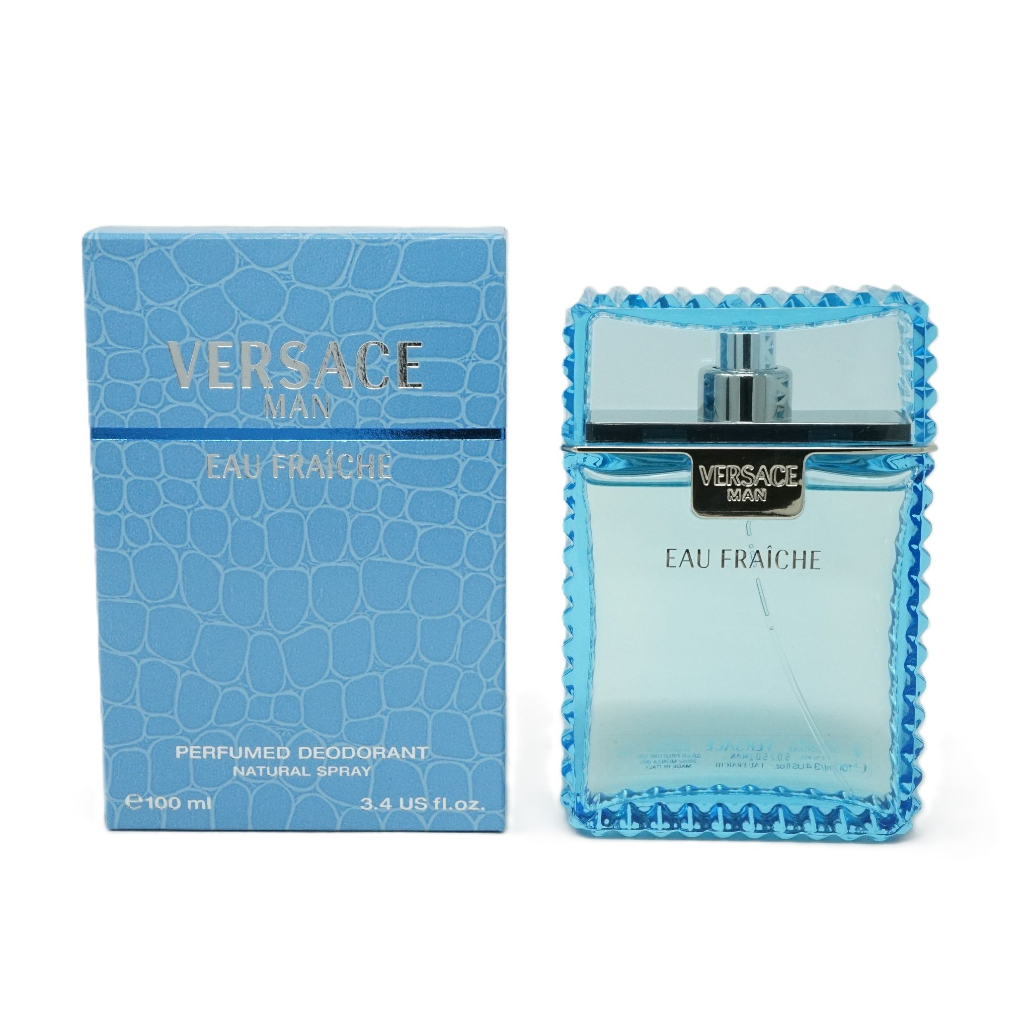 Eau Fraiche-Parfümflakon und Schachtel. Flakon hellblau mit silbernem Verschluss. Schachtel blau mit Krokodilmuster.