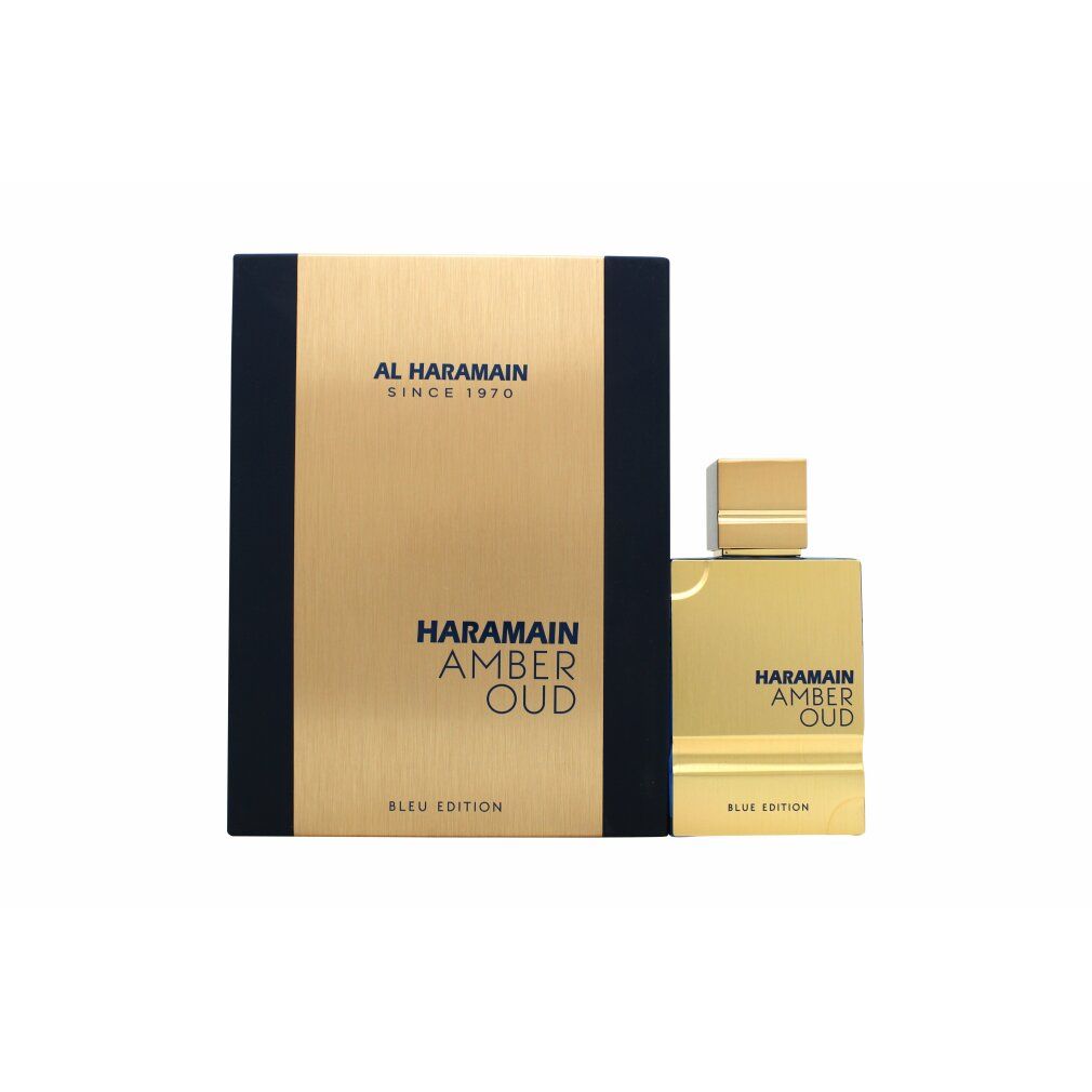 Goldfarbene Parfümflasche mit goldfarbenem Deckel. Rechteckige Verpackung mit Markenlogo und Produktnamen.