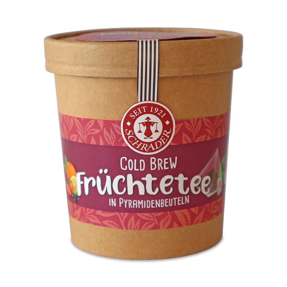 Zylindrische Pappdose mit Deckel. Aufschrift: Schrader Cold Brew Früchtetee. Etikett mit Früchten. Siegel.