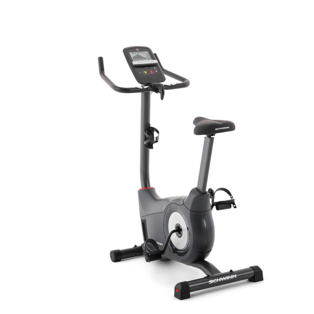 Hometrainer, schwarz. Sattel, Lenker und Konsole. Schwinn-Logo. Roter Akzent. Pedale und Flaschenhalter.