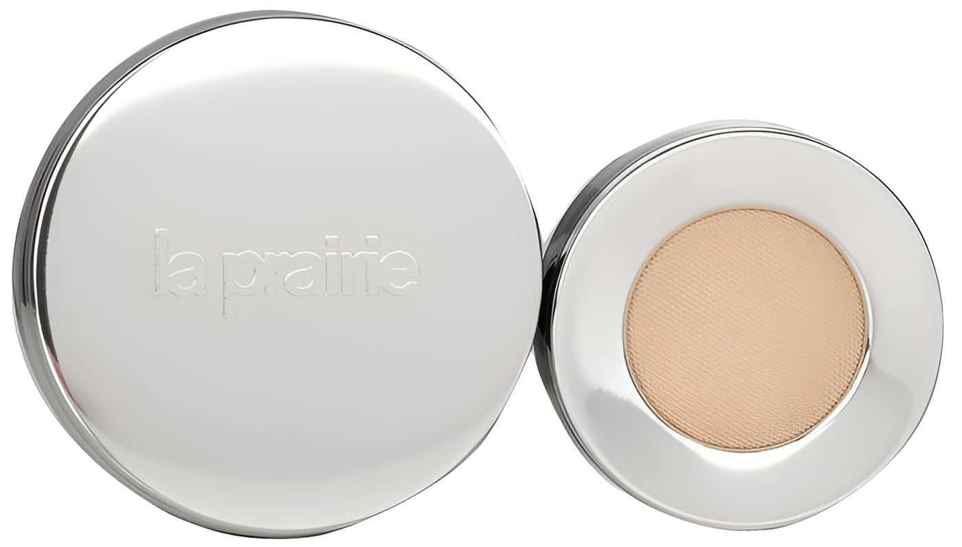 Silberner runder Behälter mit La Prairie Logo und hellbeigem Puder.
