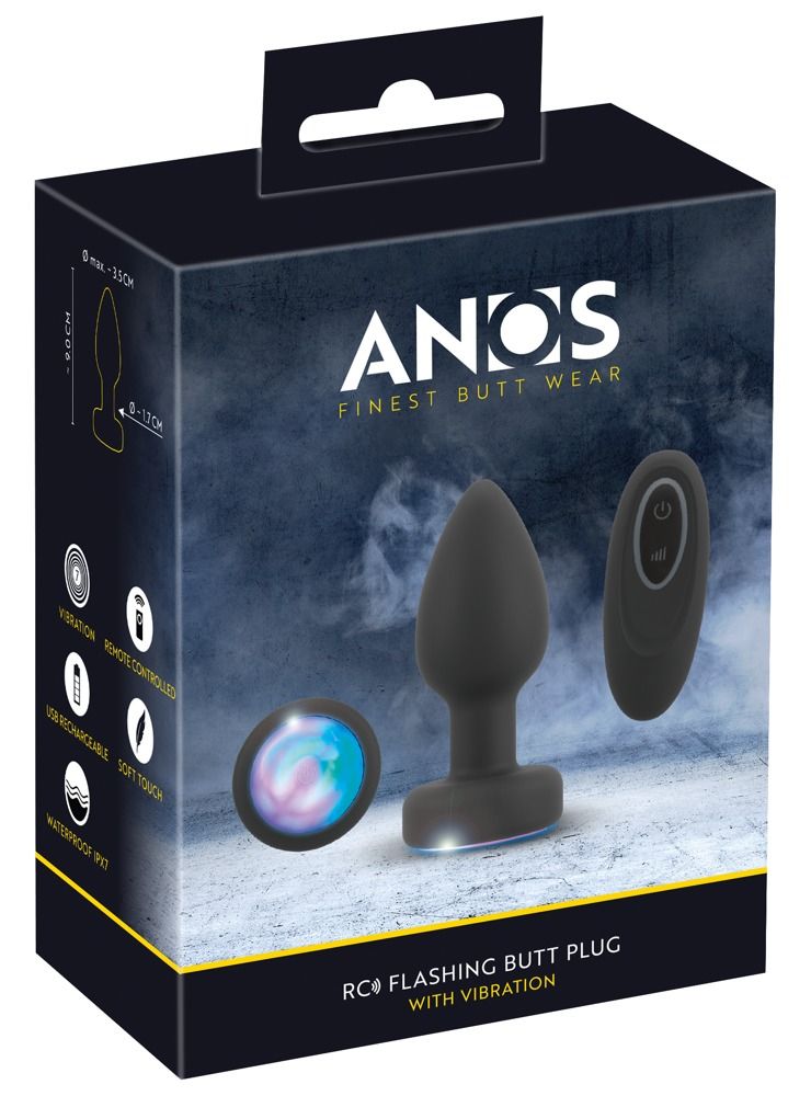 Verpackung von ANOS - Finest Butt Wear. Enthält Analplug, Fernbedienung und rundes Lichtelement. Produktname und Eigenschaften.