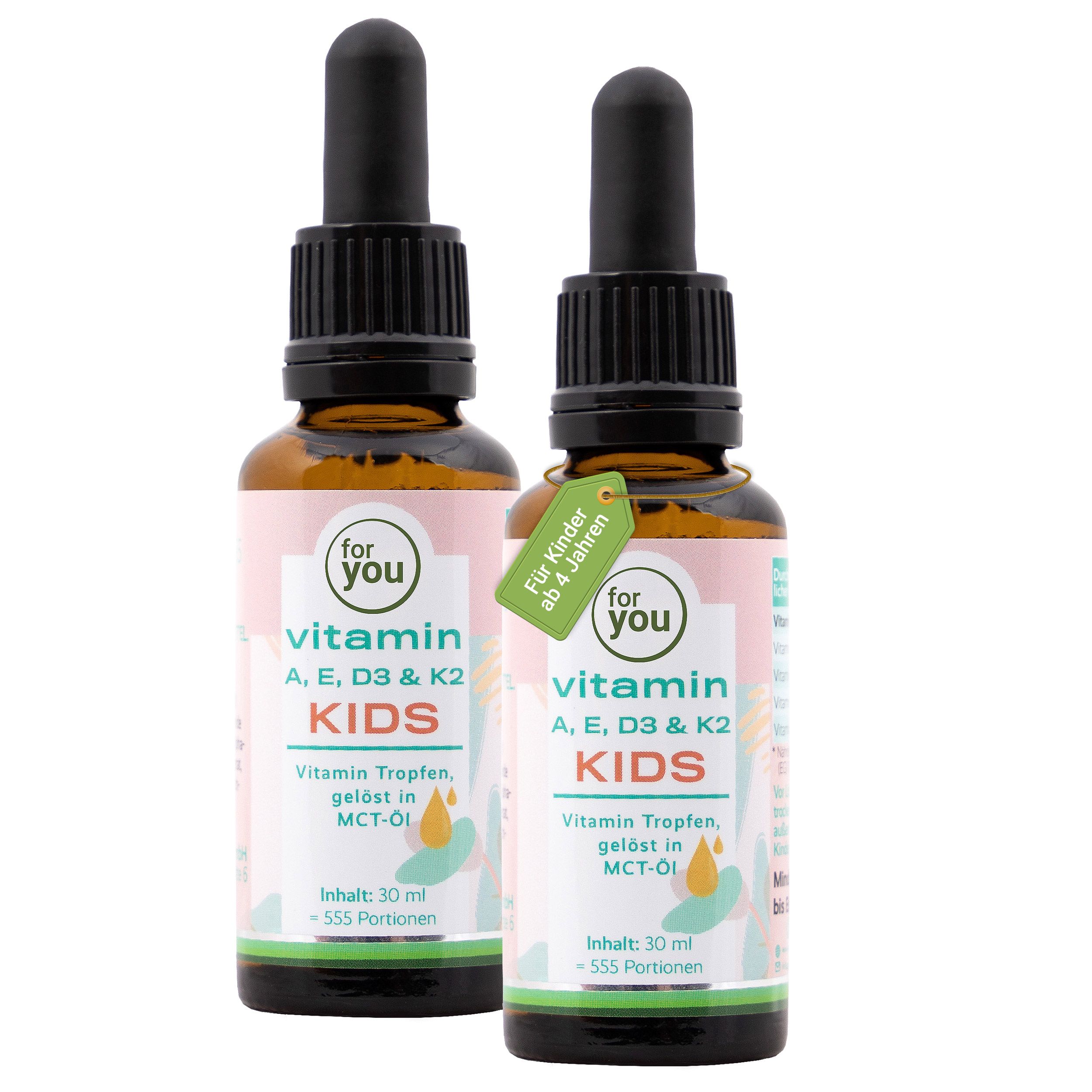 Zwei Flaschen mit Pipette für Vitamin-Tropfen für Kinder, mit Etikett 'Für Kinder ab 4 Jahren'.