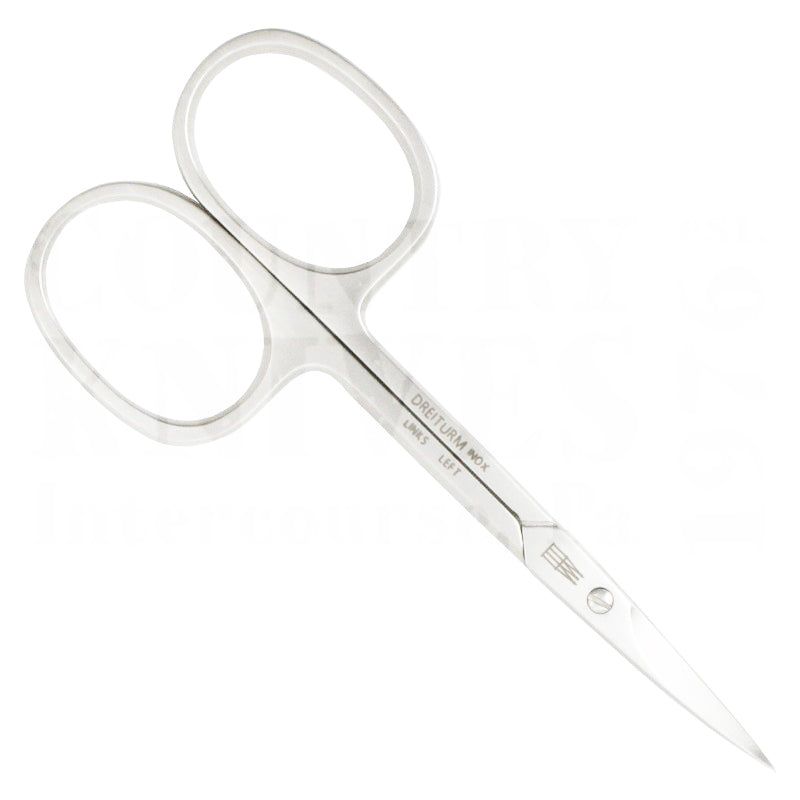 Hautschere für Linkshänder. Metall, silberfarben. Griffe mit ovalen Öffnungen. Klingen spitz zulaufend. Aufschrift: DREITURM INOX LINKS LEFT.