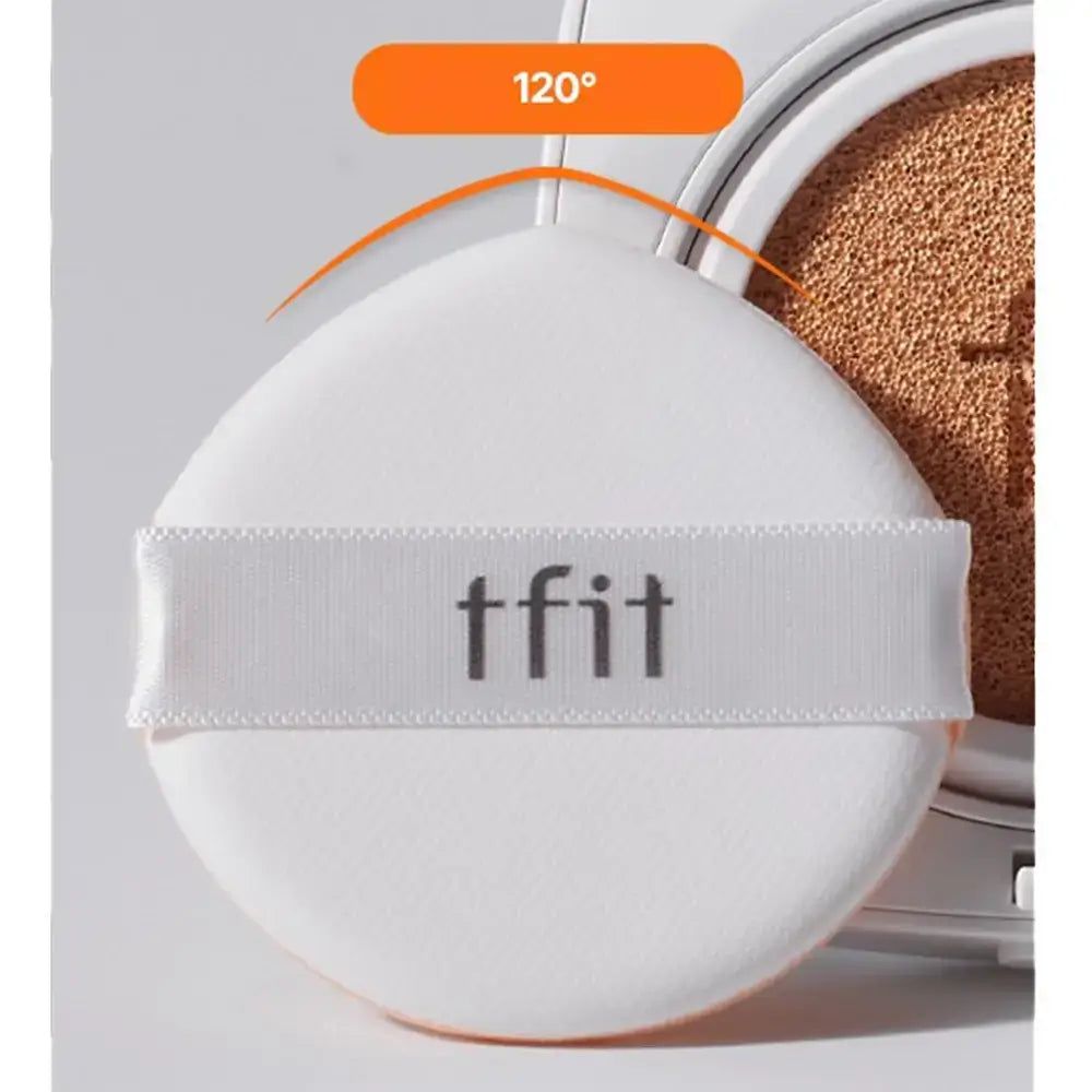 Weißer Schwamm mit Band. Auf dem Band steht 'tfit' in schwarzer Schrift. Der Schwamm liegt auf einem geöffneten Cushion.