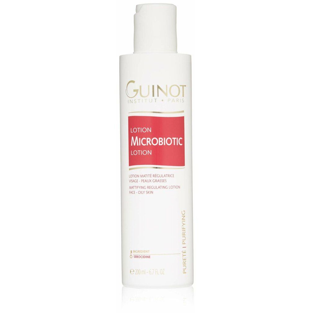 Weißes Fläschchen mit weißem Deckel. Roter Aufkleber mit Text. Guinot-Logo. "Microbiotic Lotion"-Text. Für fettige Haut.