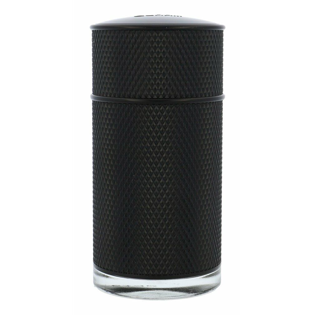 Flacone cilindrico nero con superficie a rilievo. Tappo nero. Base in vetro.
