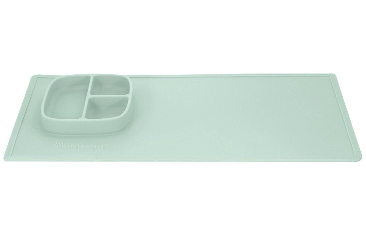Aquamarinfarbene Spielmatte mit integriertem, dreigeteiltem Teller. Rechteckige Form, abgerundete Ecken.