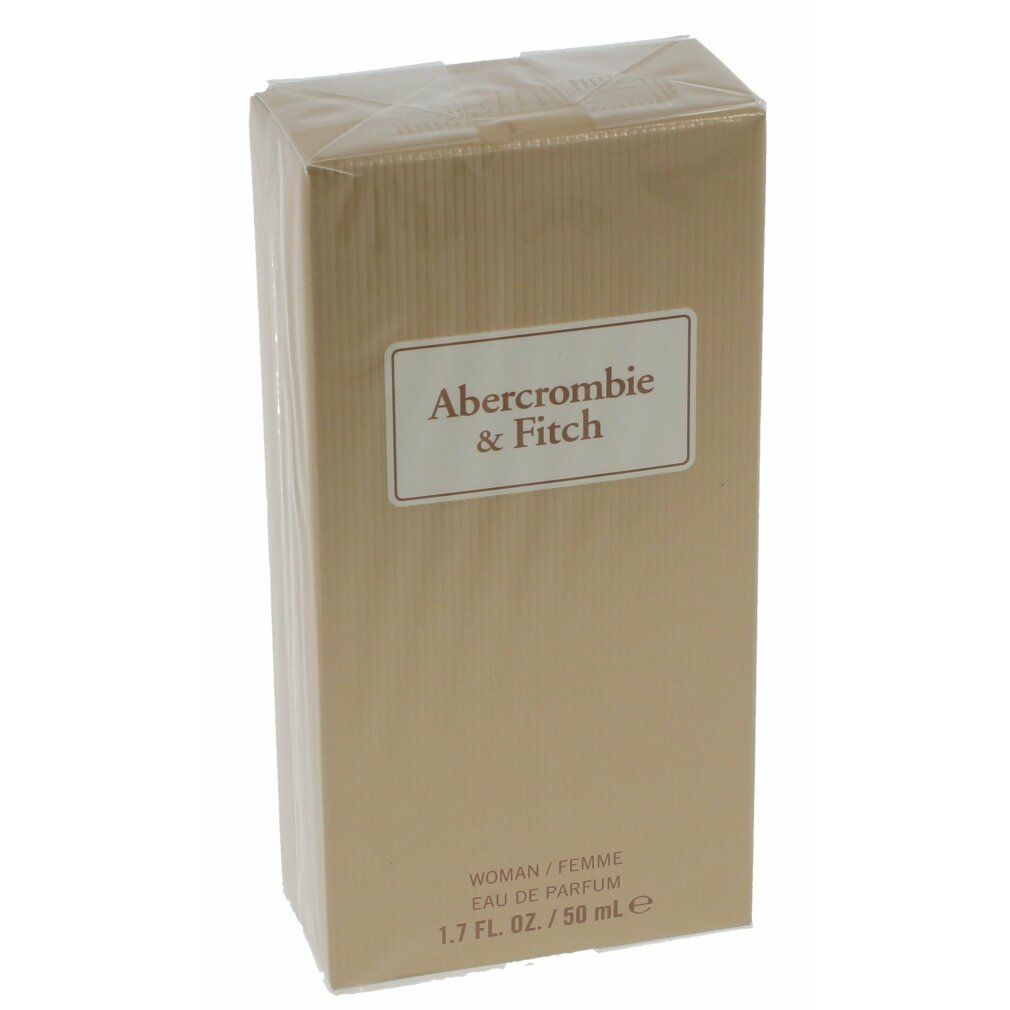 Parfümverpackung in Gold mit Markenlogo. Text: Abercrombie & Fitch, Woman/Femme, Eau de Parfum, 1.7 FL. OZ./50 ml e.