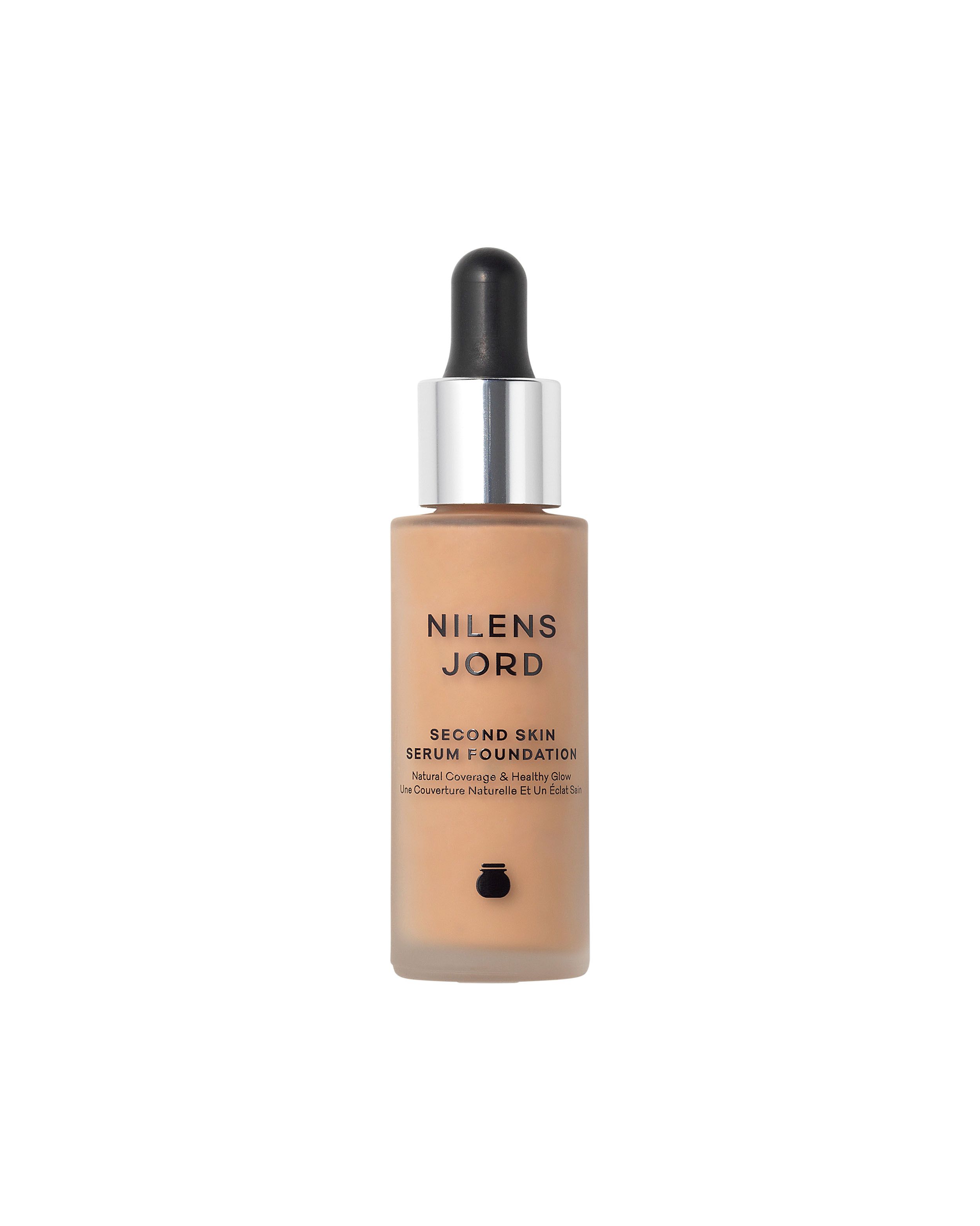 Nilens Jord Second Skin Serum Foundation in einem Glasfläschchen mit Pipette. Heller Hautton.