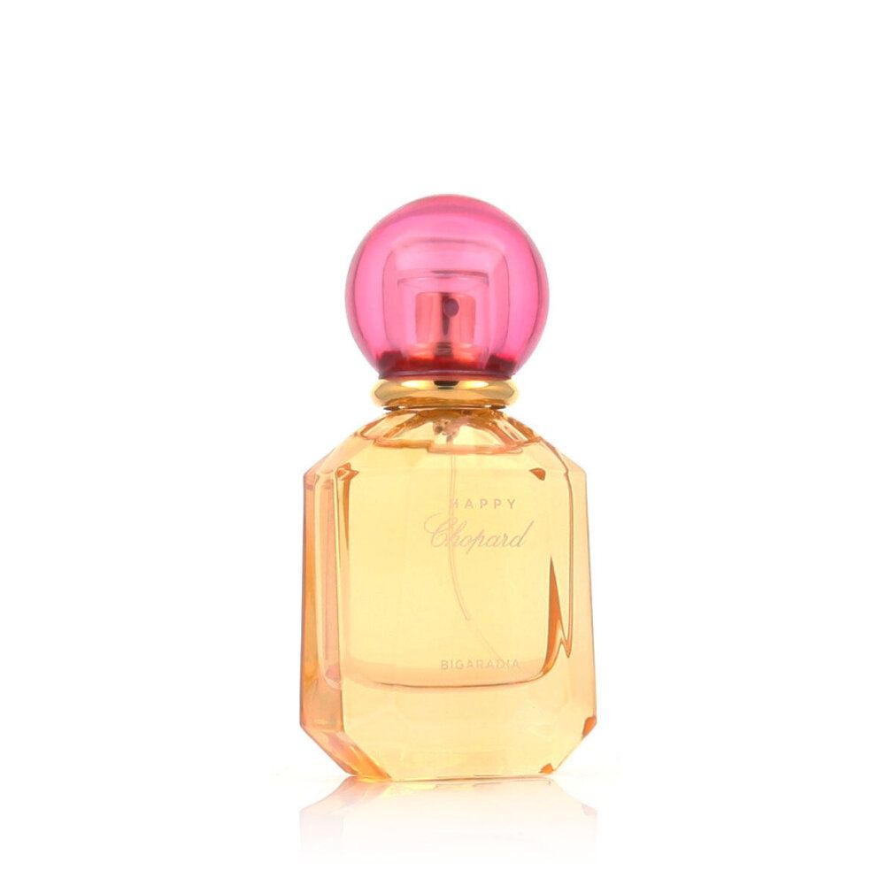Parfümflasche mit rosa Kappe und gelber Flüssigkeit. Aufschrift Happy Chopard Bigaradia.