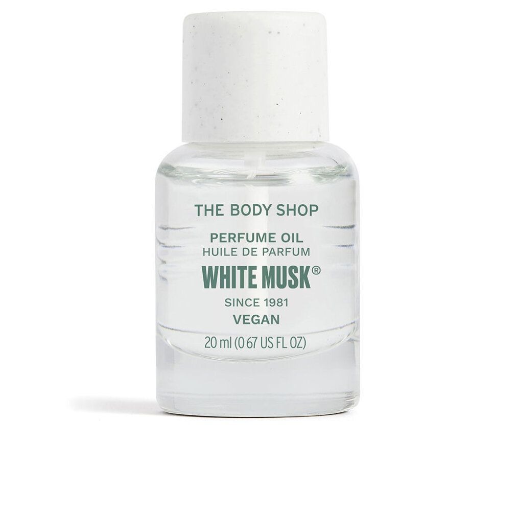 Klarflüssiges Parfümöl in einer kleinen Glasflasche mit weißem Deckel. Aufschrift: White Musk, Vegan, The Body Shop.