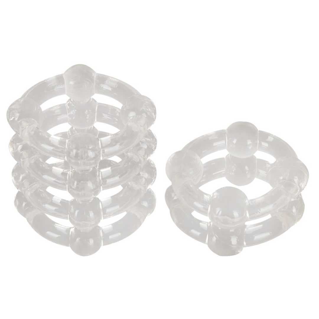 Mehrere transparente Ringe mit Noppen. Material scheint Kunststoff zu sein. Ringförmige Struktur mit erhabenen Elementen.
