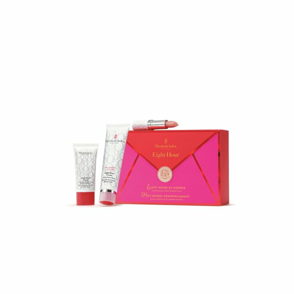 Geschenkset mit drei Produkten. Eine Tube, eine kleine Tube und ein Lippenstift liegen neben einer pinkfarbenen Schachtel.