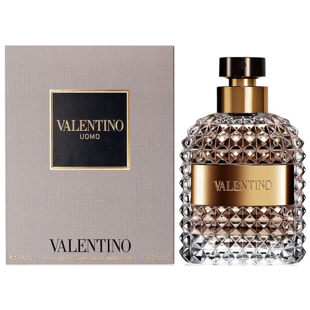 Valentino Uomo Edt Spray und Verpackung. Flakon und graue Schachtel. Schwarzes Etikett mit goldener Schrift.