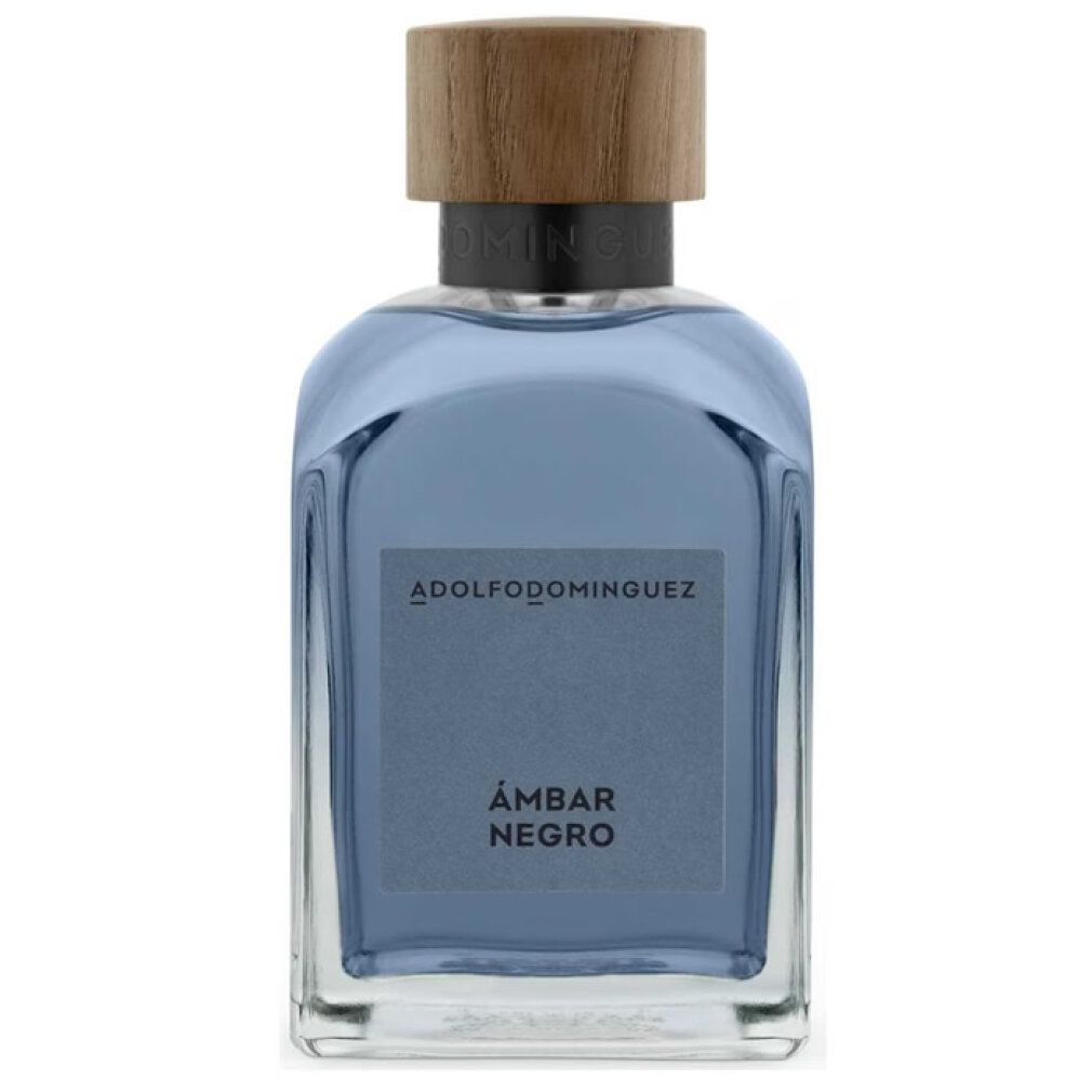 Parfümflasche mit Holzdeckel. Auf dem Etikett steht ADOLFODOMINGUEZ und ÁMBAR NEGRO. Blaue Flüssigkeit in einem quadratischen Glasbehälter.