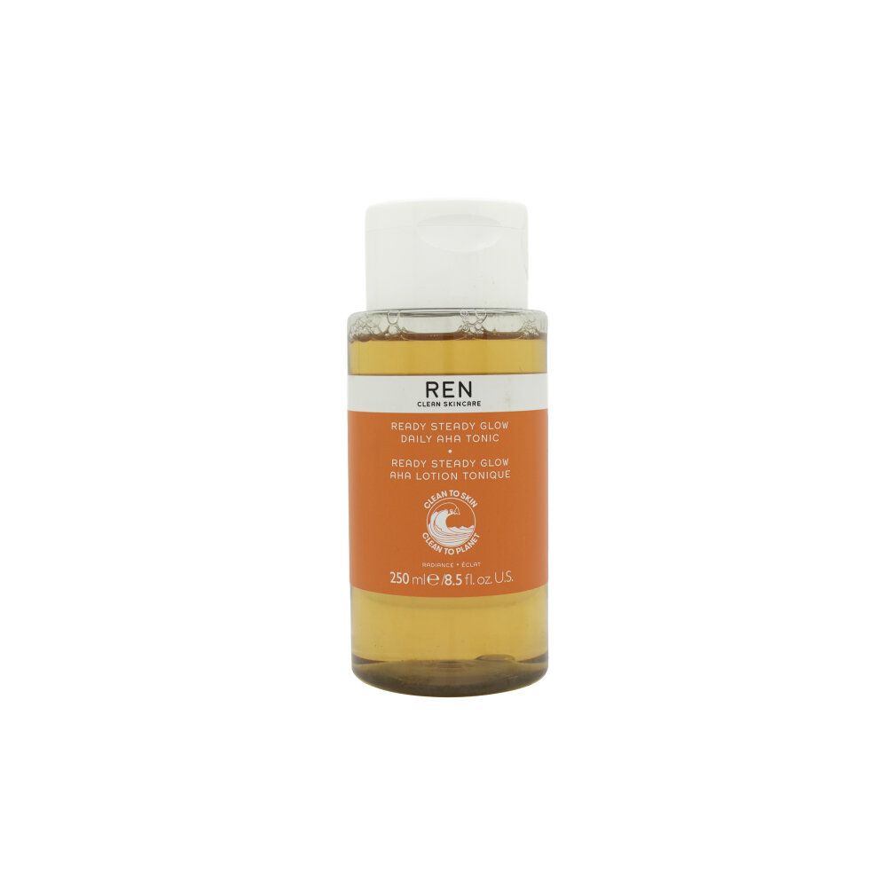 REN Ready Steady Glow AHA Tonic. Flasche mit weißem Deckel und Dosierpumpe. Orangefarbenes Etikett mit Text.